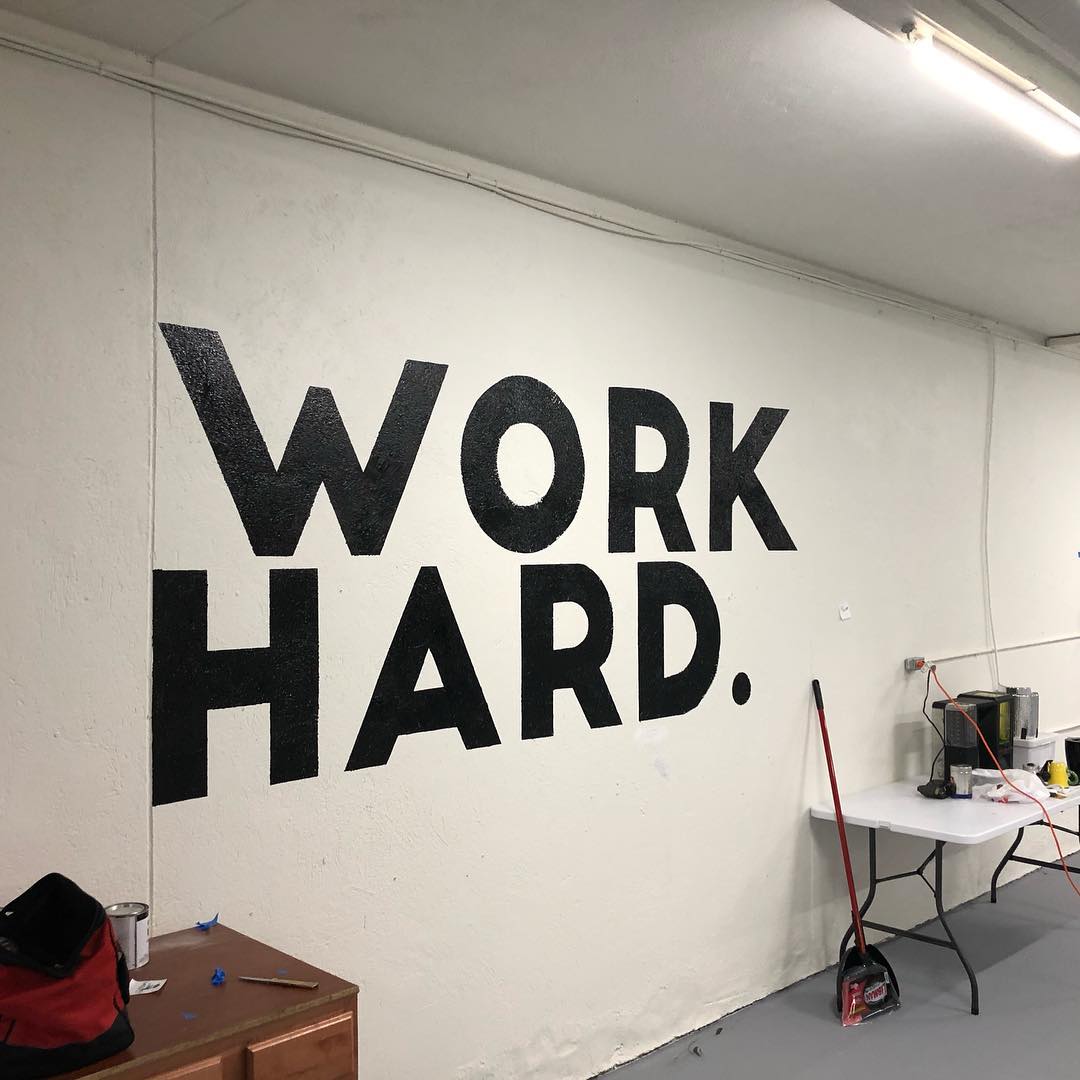 Wall at The Workbench Fort Wayne that reads "Work Hard."